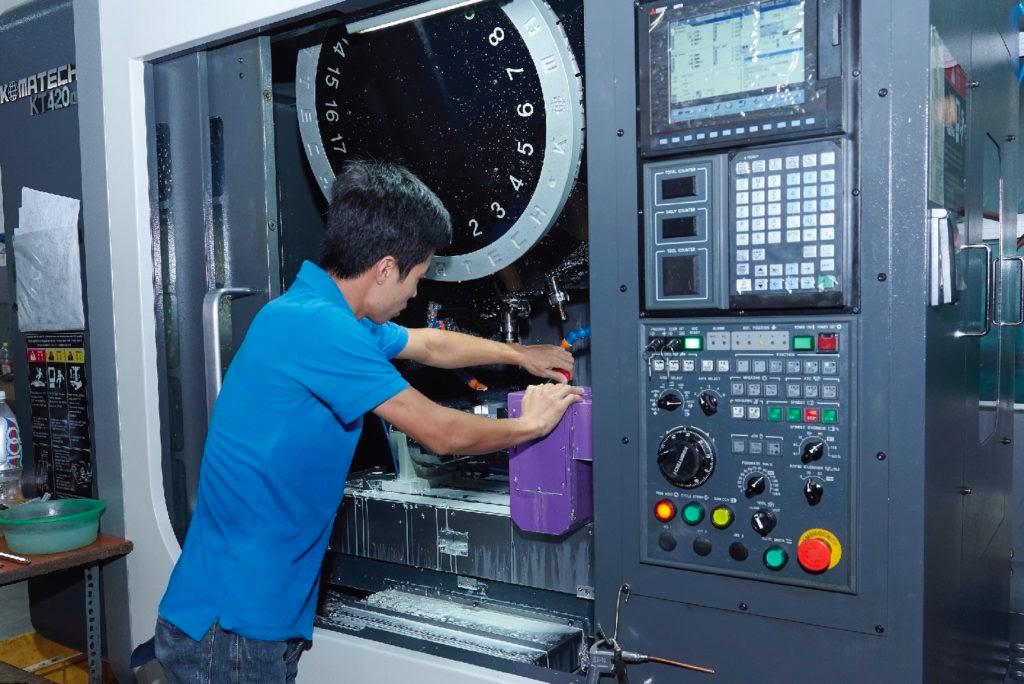 an operator working on cnc machine